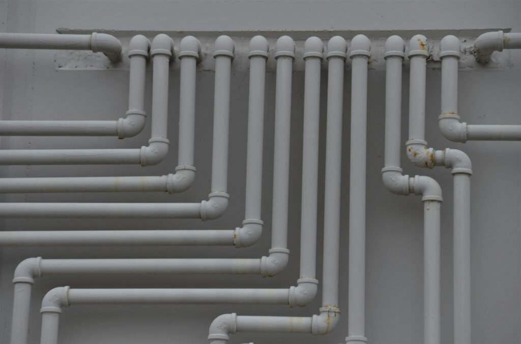 a close up of a bunch of pipes on a wall
